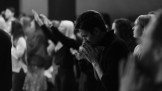 A man praying in church.